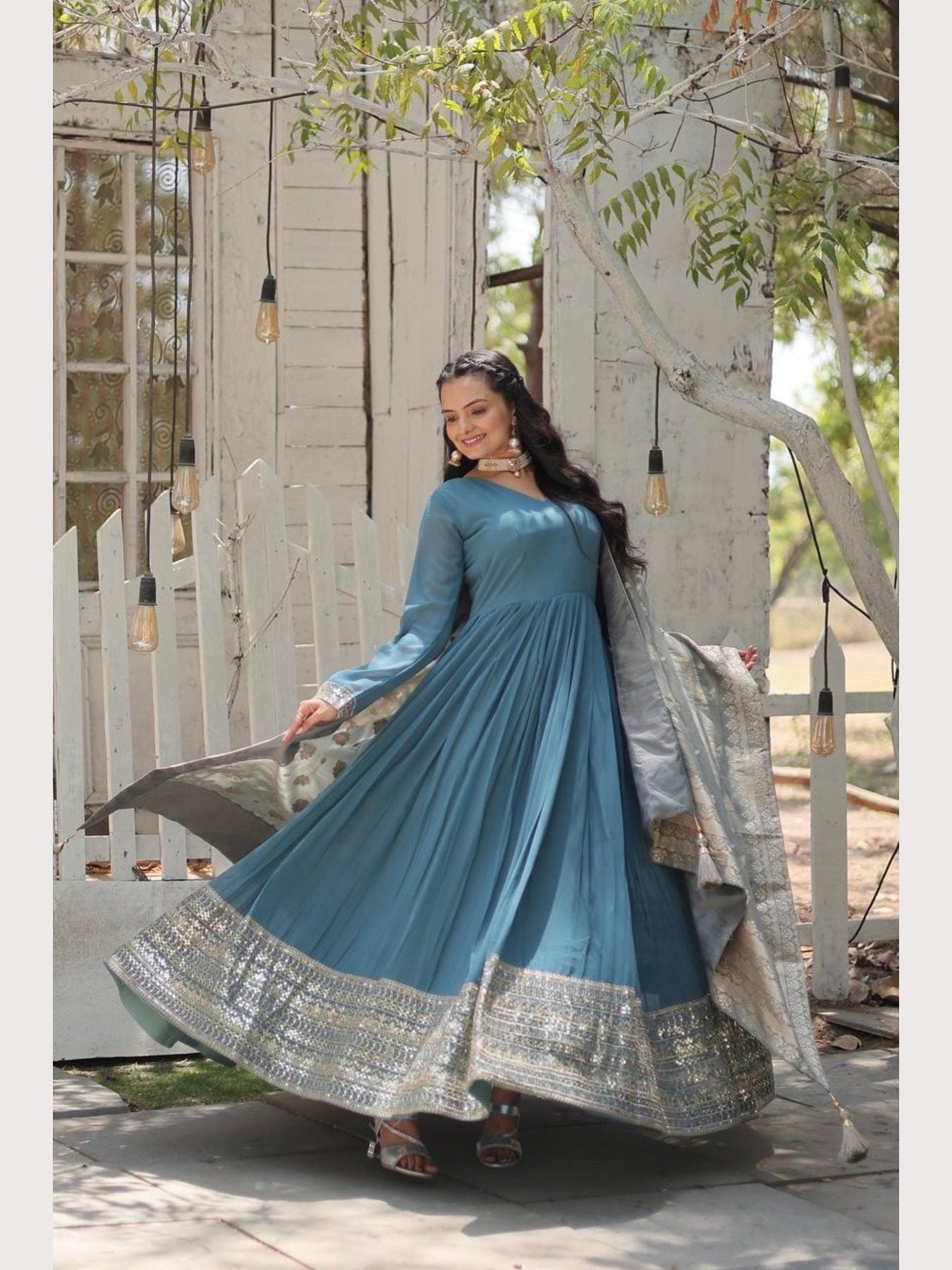 Blue gown with flowing design and embroidered dupatta