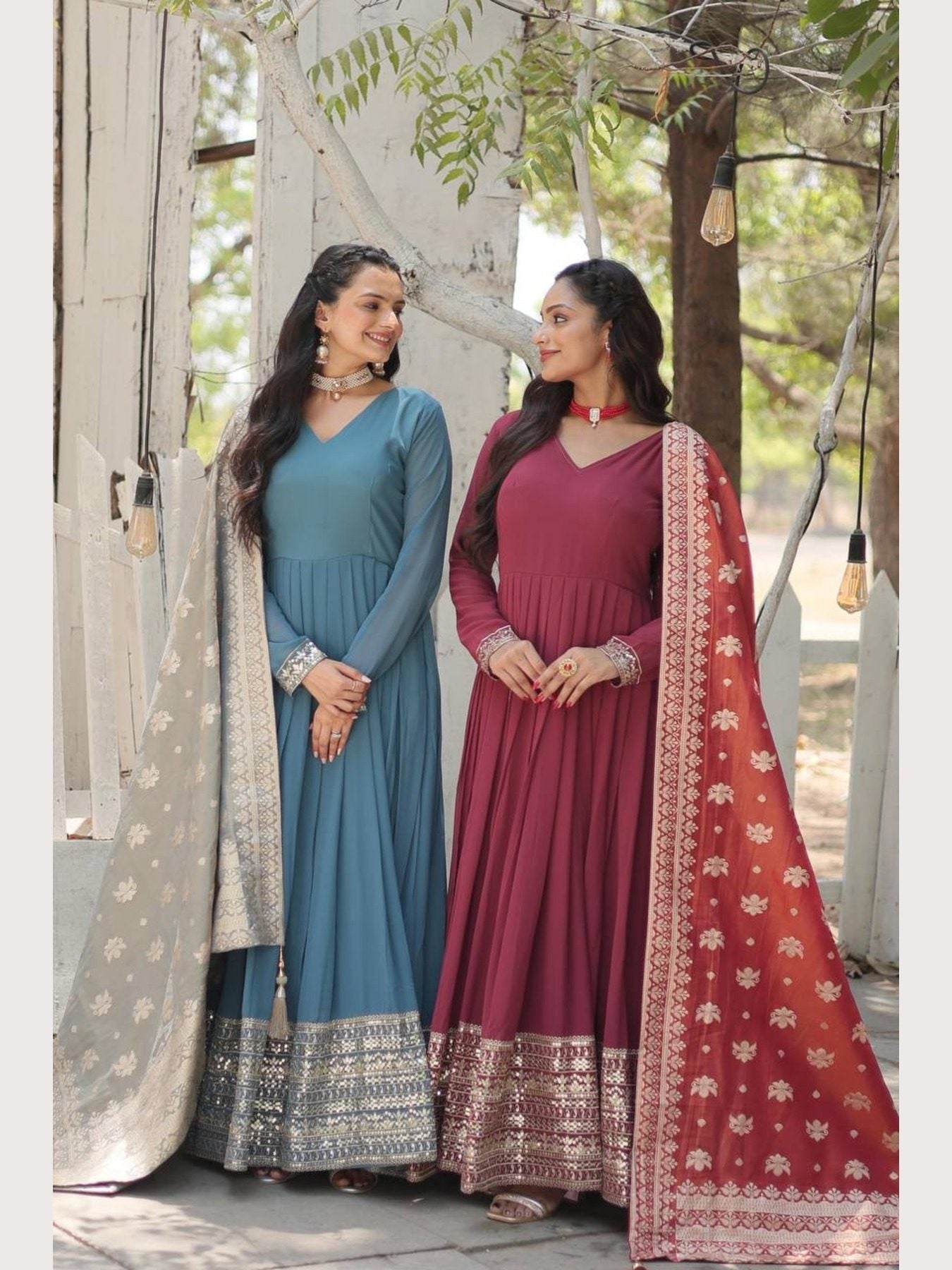 Women in blue and maroon gowns, sequins embroidery detail