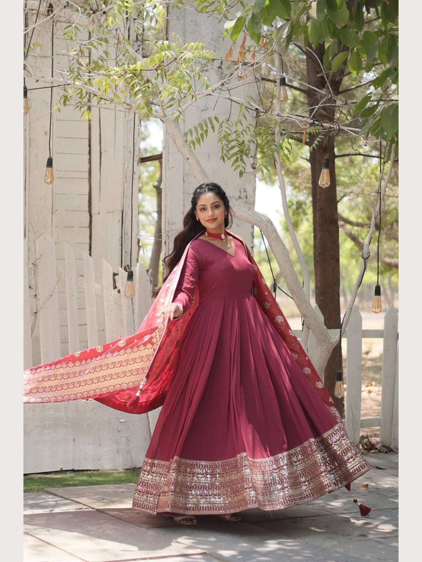 Elegant V-Neck Gown with Latkan Jhumka Border