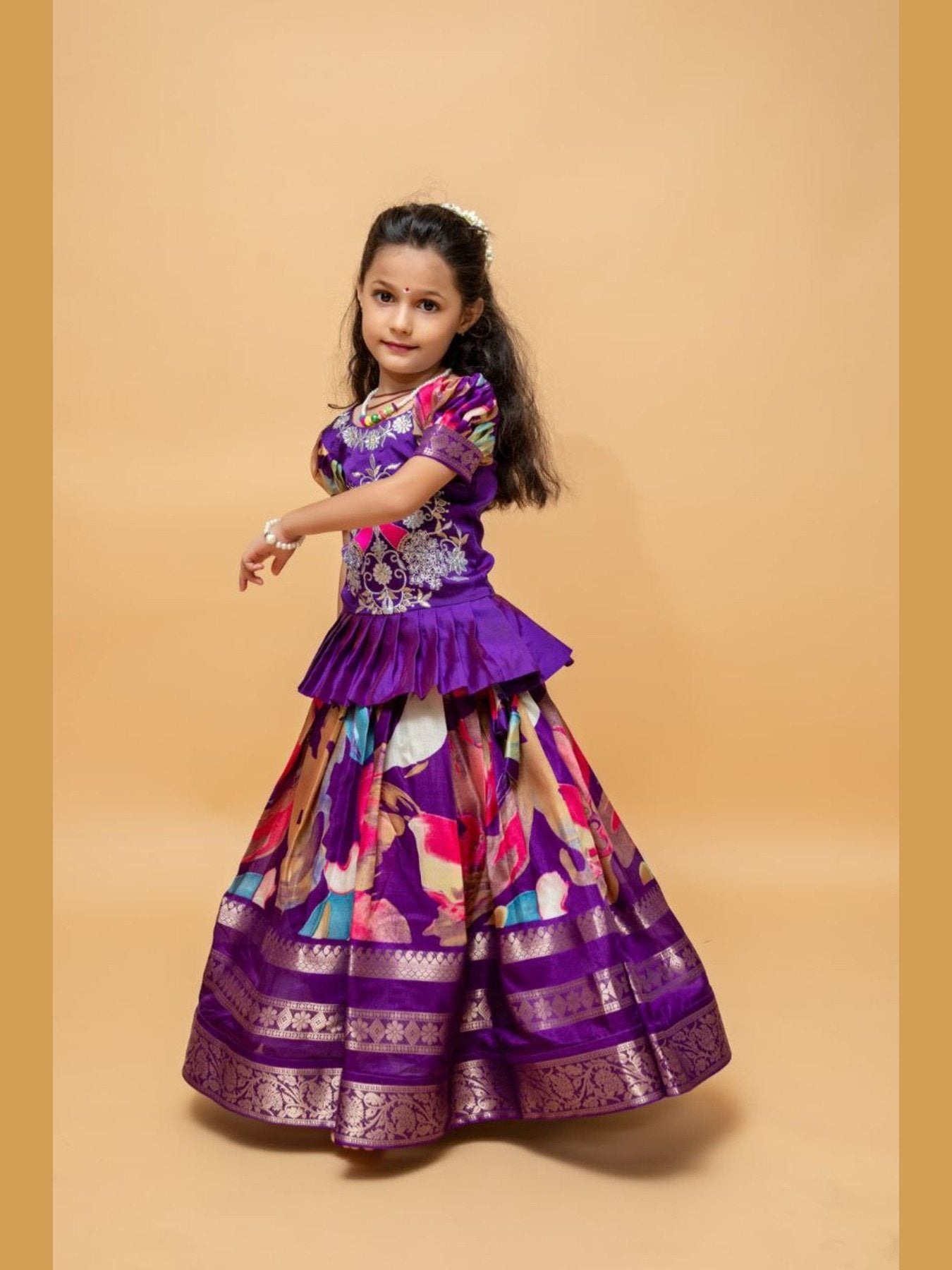 Girl in purple embroidered lehenga choli, festive wear