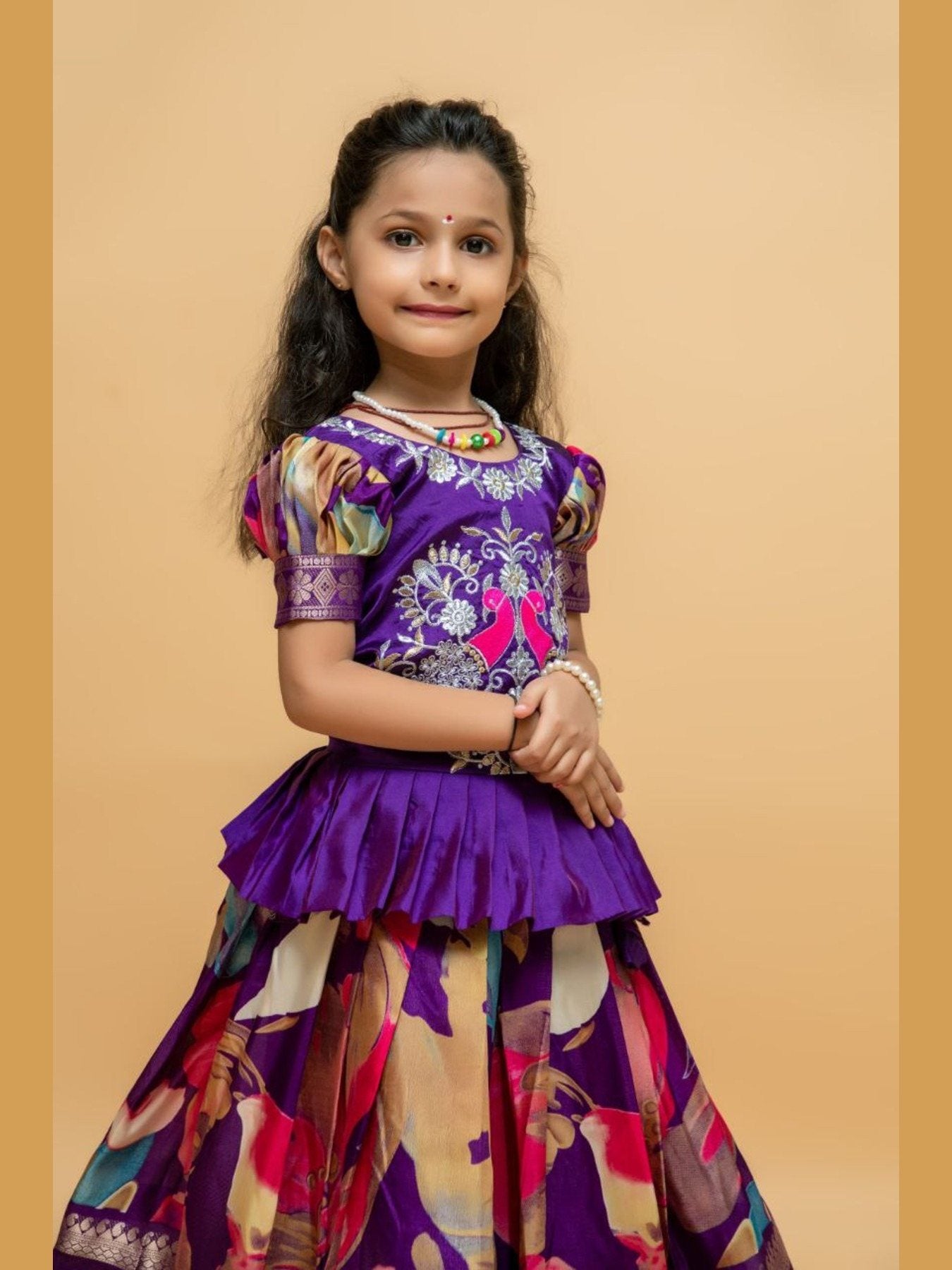 Close-up of girl in purple embroidered lehenga choli