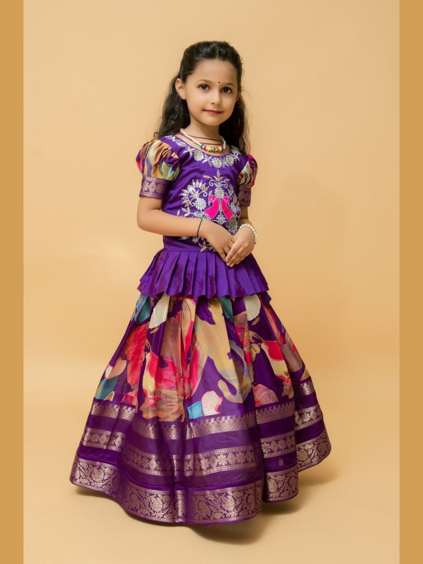 Side view of girl in purple lehenga choli, festive wear