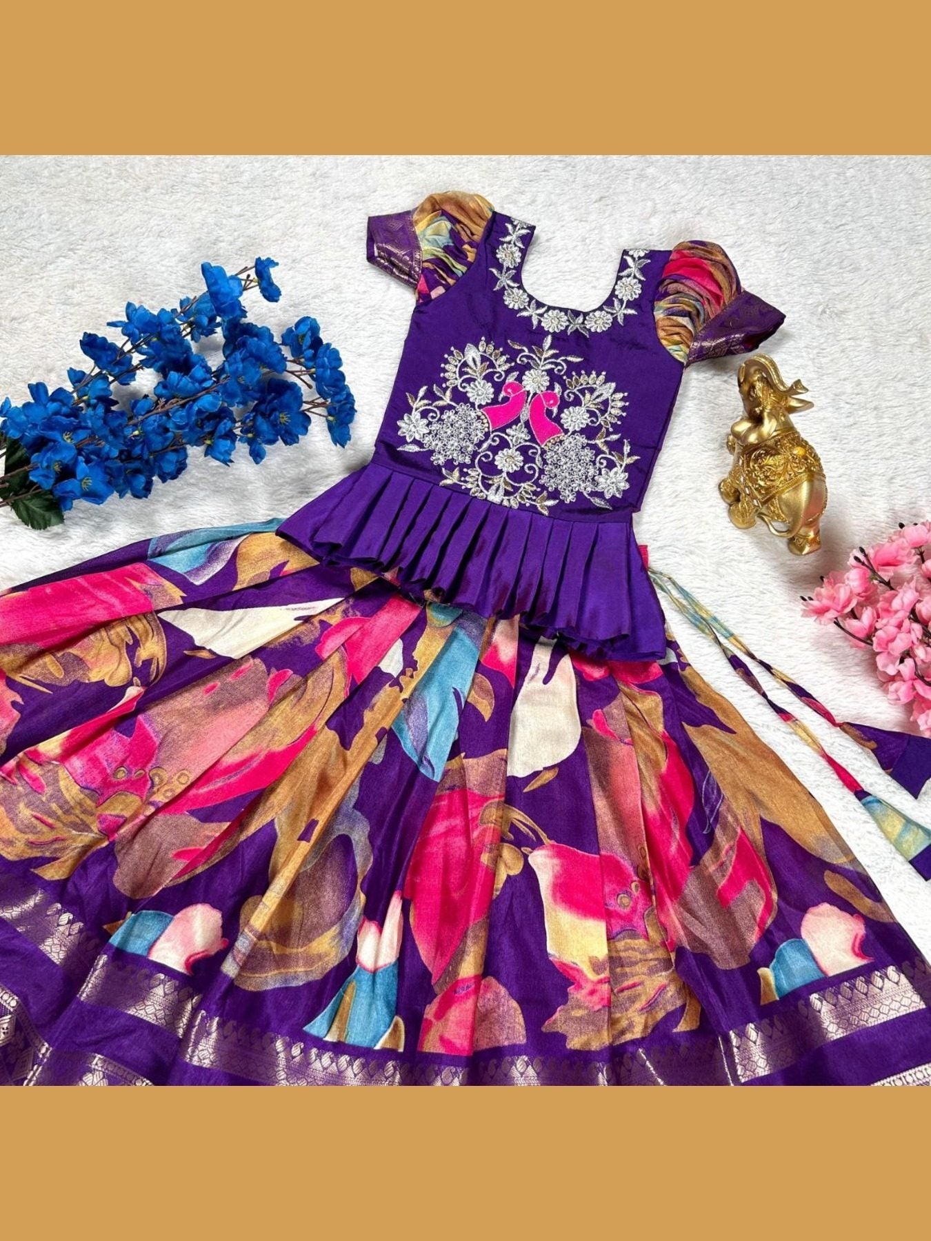 Purple lehenga choli with floral design and accessories